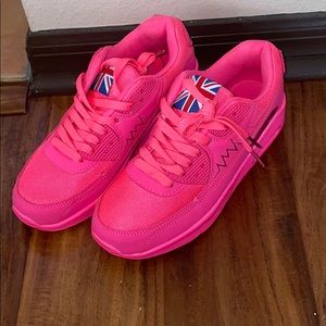 Brand new hot pink athletic sneakers.